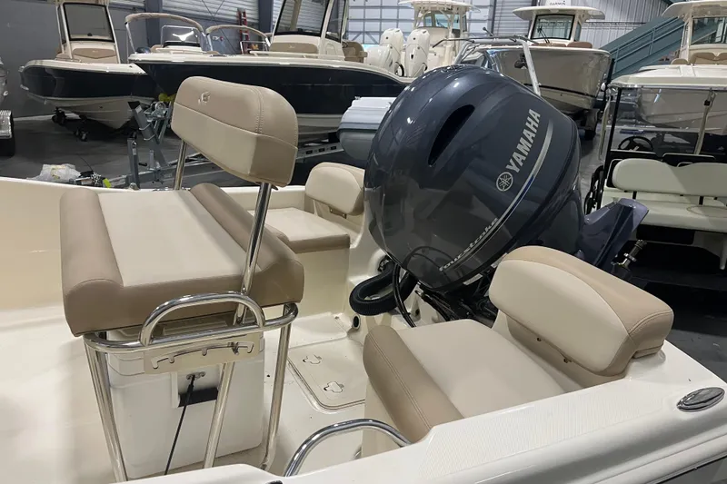 Slide: The Image of 2025 Scout 175 Sportfish boat interior with Yamaha engine in showroom. - 5