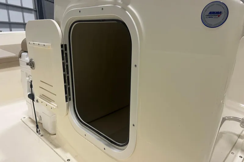 Slide: The Image of 2025 Scout 175 Sportfish boat interior with open storage compartment. - 7