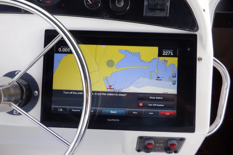 Slide: The Image of Steering wheel and Garmin navigation display on 1998 Bayliner 4788 Pilot House Motoryacht. - 10