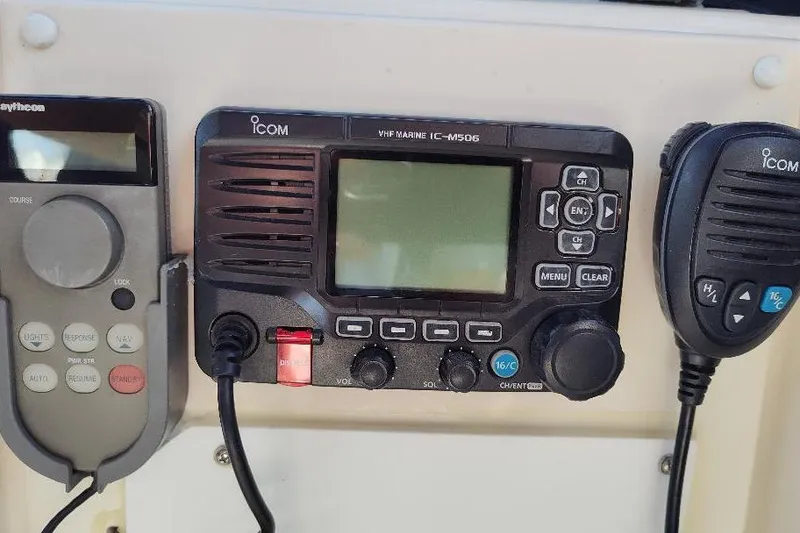 Slide: The Image of Control panel of a 1998 Bayliner 4788 Pilot House Motoryacht with Icom VHF radio. - 13