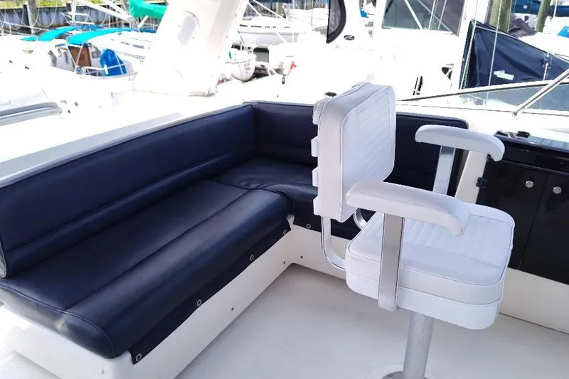 Slide: The Image of 1998 Bayliner 4788 Pilot House Motoryacht interior with seating and helm chair. - 15
