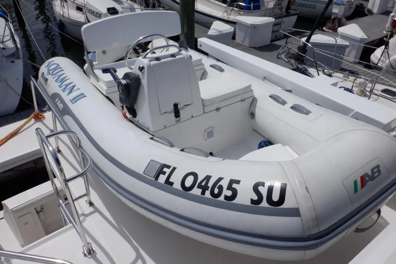 Slide: The Image of Inflatable boat docked beside a 1998 Bayliner 4788 Pilot House Motoryacht. - 21