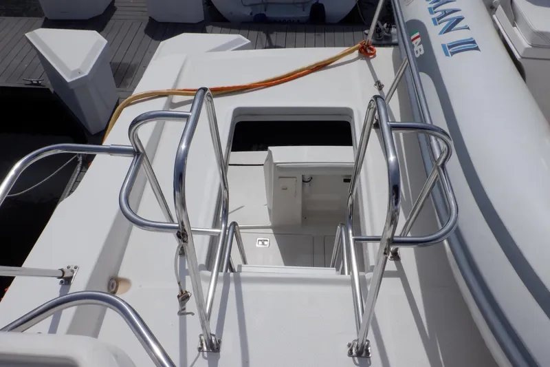 Slide: The Image of 1998 Bayliner 4788 Pilot House Motoryacht deck with stainless steel railings and hatch. - 24