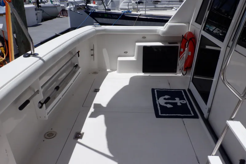 Slide: The Image of 1998 Bayliner 4788 Pilot House Motoryacht deck with anchor mat and safety equipment. - 27