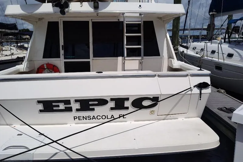 Slide: The Image of 1998 Bayliner 4788 Pilot House Motoryacht docked, named "Epic" in Pensacola, FL. - 33
