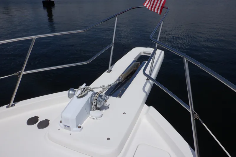 Slide: The Image of Bow of 1998 Bayliner 4788 Pilot House Motoryacht with anchor and American flag. - 34
