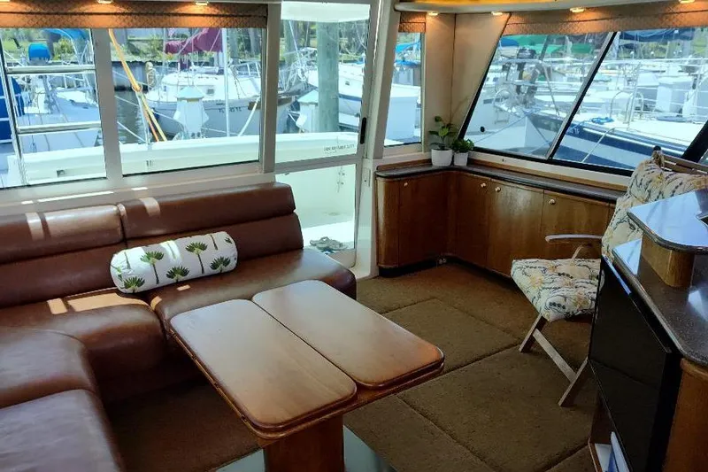 Slide: The Image of Luxurious interior of 1998 Bayliner 4788 Pilot House Motoryacht with leather seating and wooden accents. - 39