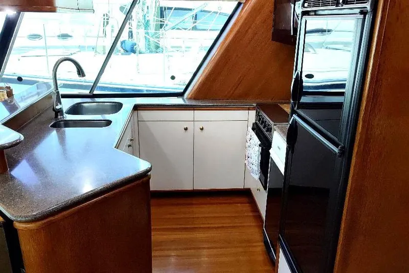 Slide: The Image of Luxurious kitchen interior of 1998 Bayliner 4788 Pilot House Motoryacht with modern amenities. - 41