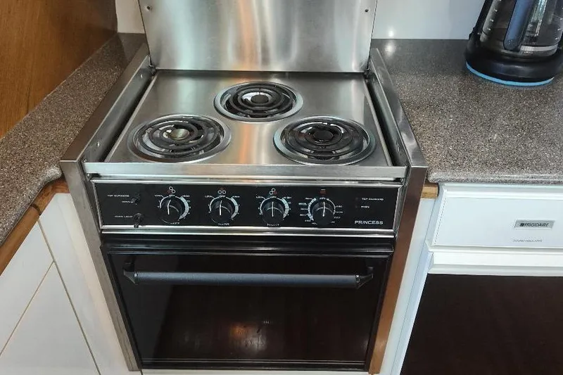 Slide: The Image of Stainless steel stove and oven in 1998 Bayliner 4788 Pilot House Motoryacht kitchen. - 42