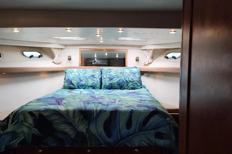 Slide: The Image of Luxurious bedroom in 1998 Bayliner 4788 Pilot House Motoryacht with tropical bedding. - 62