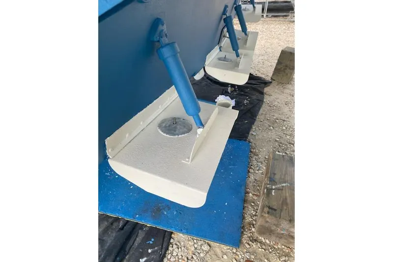 Slide: The Image of 1998 Bayliner 4788 Pilot House Motoryacht hull detail with stabilizers on dry dock. - 80