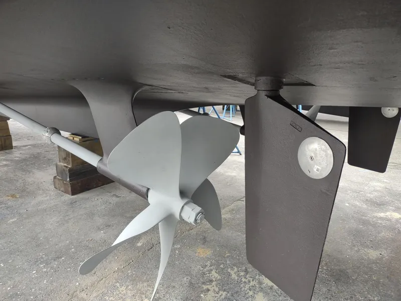 Slide: The Image of Propeller and rudder of 1996 Hatteras 50' Sport Deck yacht on dry dock. - 15