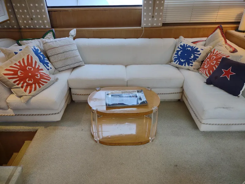 Slide: The Image of Luxurious 1996 Hatteras 50' Sport Deck interior with white sofa and colorful cushions. - 20