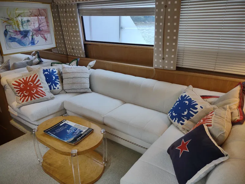 Slide: The Image of Luxurious interior of 1996 Hatteras 50' Sport Deck with white sectional and colorful pillows. - 21
