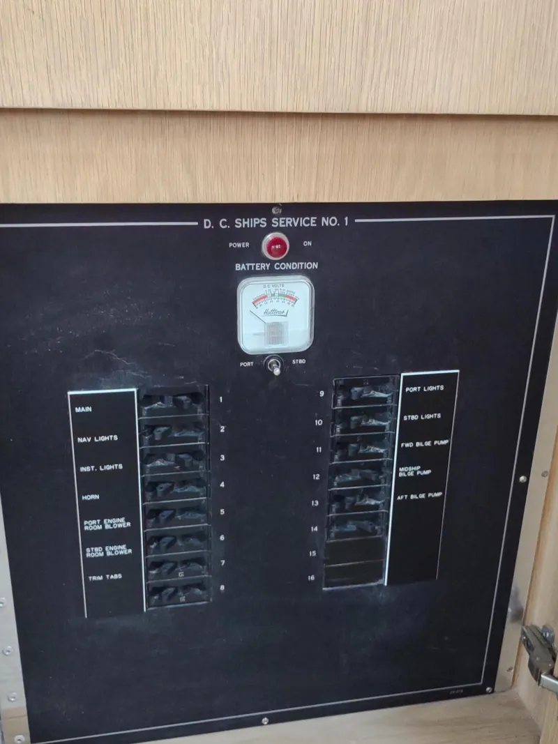 Slide: The Image of Electrical panel on a 1996 Hatteras 50' Sport Deck yacht, showing battery condition and switches. - 29