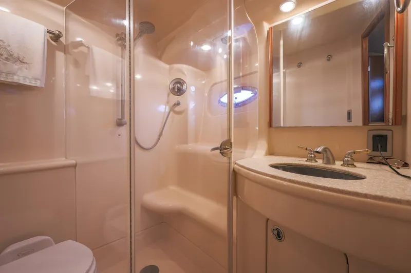 Slide: The Image of Luxurious bathroom in 2004 Meridian 411 Sedan yacht with shower and sink. - 19