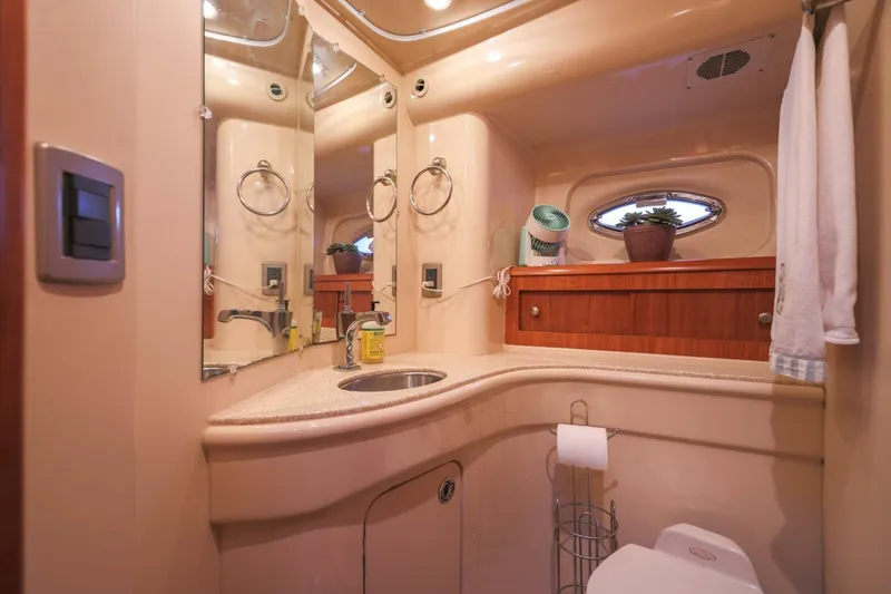 Slide: The Image of Luxurious bathroom in 2004 Meridian 411 Sedan yacht with modern fixtures and elegant design. - 23