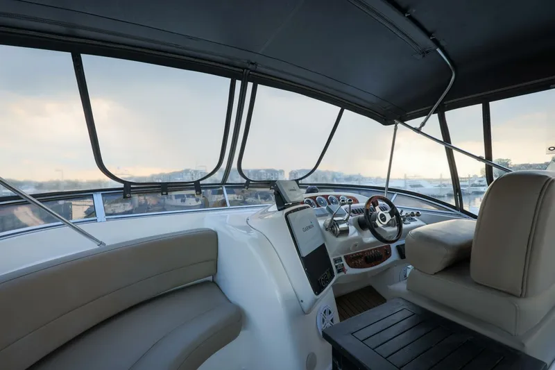 Slide: The Image of Interior view of 2004 Meridian 411 Sedan yacht cockpit with steering wheel and seating. - 31