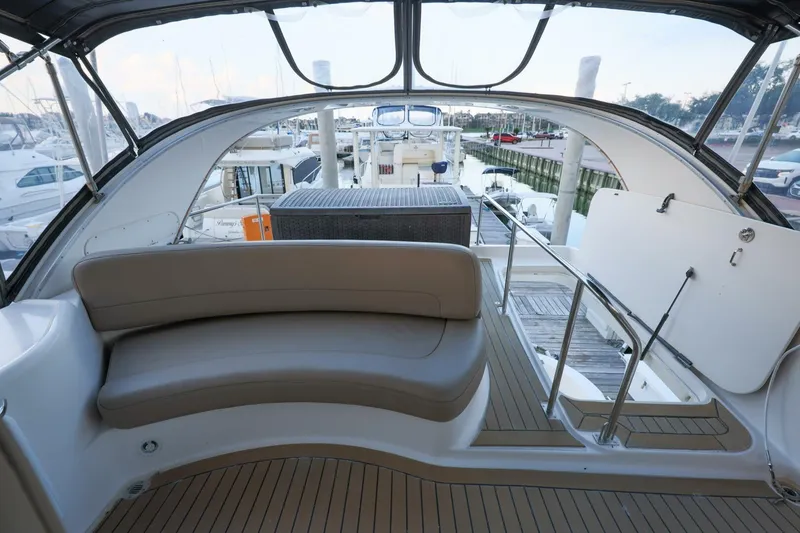 Slide: The Image of 2004 Meridian 411 Sedan yacht interior with seating and marina view. - 32