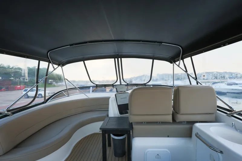 Slide: The Image of Interior view of 2004 Meridian 411 Sedan yacht with seating and helm station. - 34