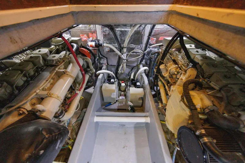 Slide: The Image of Engine room of a 2004 Meridian 411 Sedan, showcasing dual engines and mechanical components. - 40