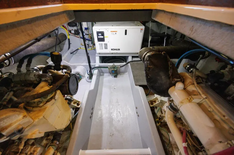 Slide: The Image of Engine room of 2004 Meridian 411 Sedan with Kohler generator and mechanical components. - 41