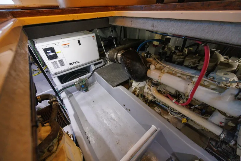 Slide: The Image of Engine room of 2004 Meridian 411 Sedan with Kohler generator and mechanical components. - 43