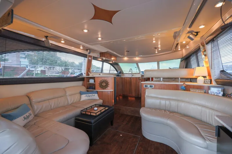 Slide: The Image of Luxurious interior of a 2004 Meridian 411 Sedan yacht with leather seating and elegant decor. - 7