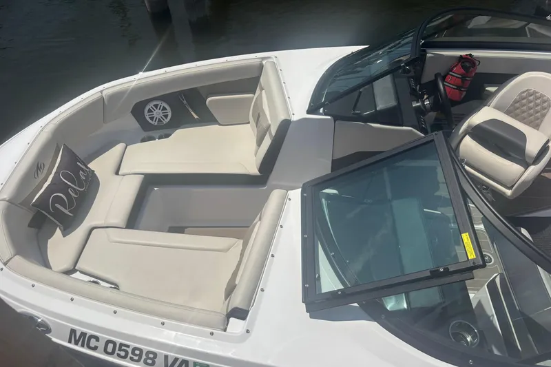 Slide: The Image of 2024 Monterey M-20 boat interior with plush seating and modern design. - 10