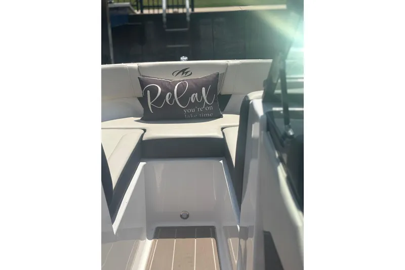 Slide: The Image of 2024 Monterey M-20 boat interior with "Relax" cushion, sunlight streaming in. - 8
