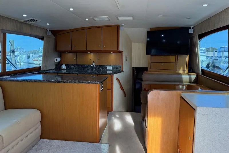 Slide: The Image of Interior of 2005 Ocean Yachts 46 Super Sport with modern kitchen and seating area. - 11