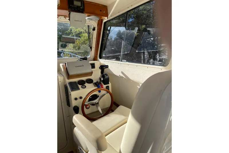 Slide: The Image of Interior of 2009 Eastern 248 Explorer boat with Garmin navigation system. - 15