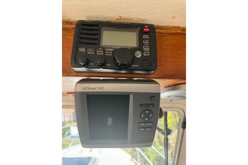 Slide: The Image of VHF radio and GPSmap 540 on 2009 Eastern 24 boat dashboard. - 7