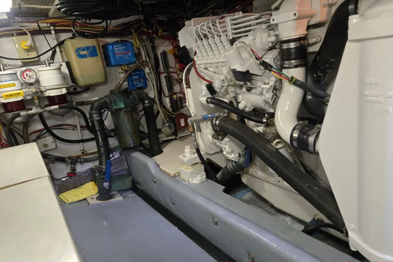Slide: The Image of Engine room of a 2000 Nordic Tug 42 Flybridge, showcasing detailed mechanical components. - 39