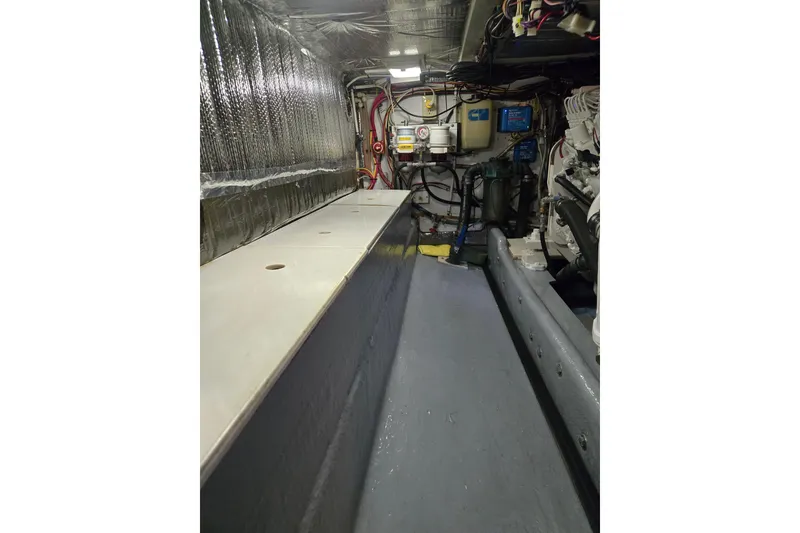 Slide: The Image of Engine room of 2000 Nordic Tug 42 Flybridge with visible wiring and components. - 41