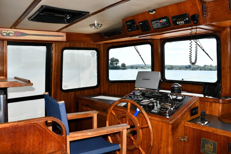 Slide: The Image of Interior of 2000 Nordic Tug 42 Flybridge with wooden helm and navigation equipment. - 20