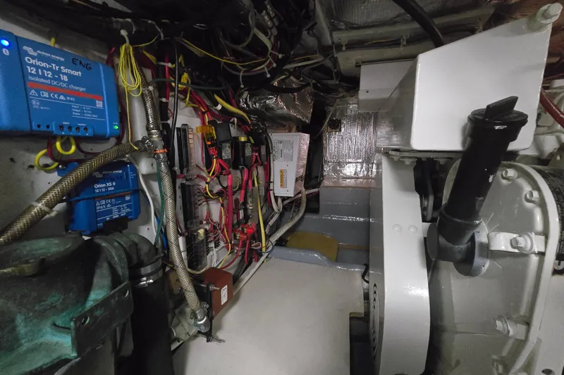 Slide: The Image of Engine room of 2000 Nordic Tug 42 Flybridge with electrical components and wiring. - 36