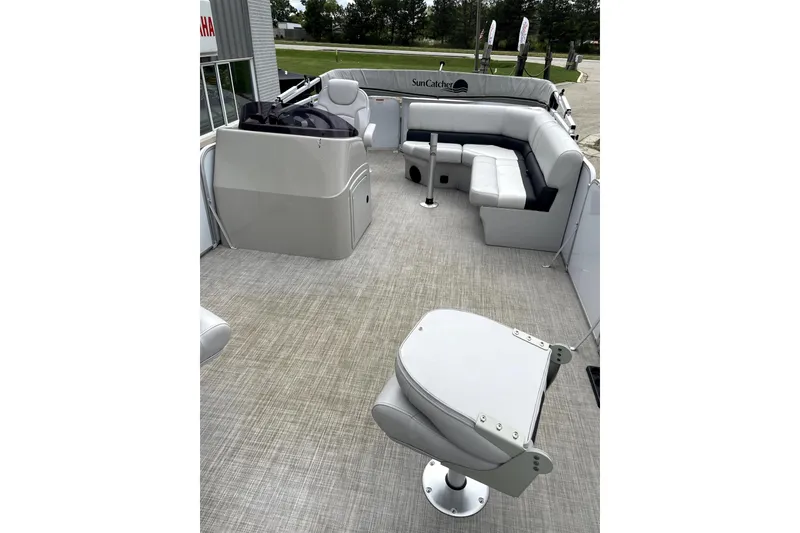 Slide: The Image of 2019 G3 SunCatcher V22 pontoon boat interior with seating and helm station. - 10