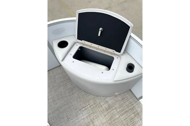 Slide: The Image of 2019 G3 SunCatcher V22 boat storage compartment with cup holders, open lid. - 13