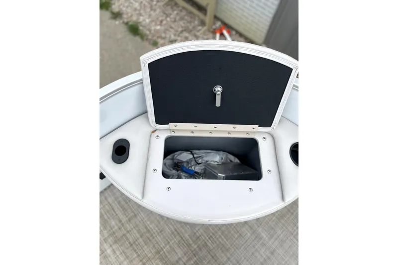 Slide: The Image of Open storage compartment on 2019 G3 SunCatcher V22 boat, showing interior space. - 14