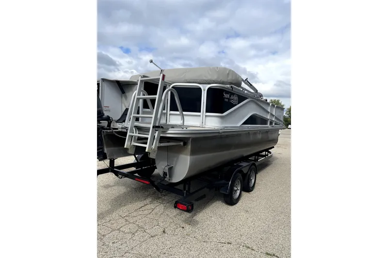 Slide: The Image of 2019 G3 SunCatcher V22 pontoon boat on trailer under cloudy sky. - 3