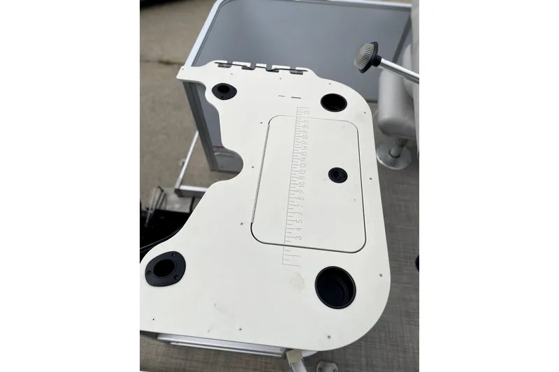 Slide: The Image of 2019 G3 SunCatcher V22 boat table with built-in cup holders and measuring guide. - 5