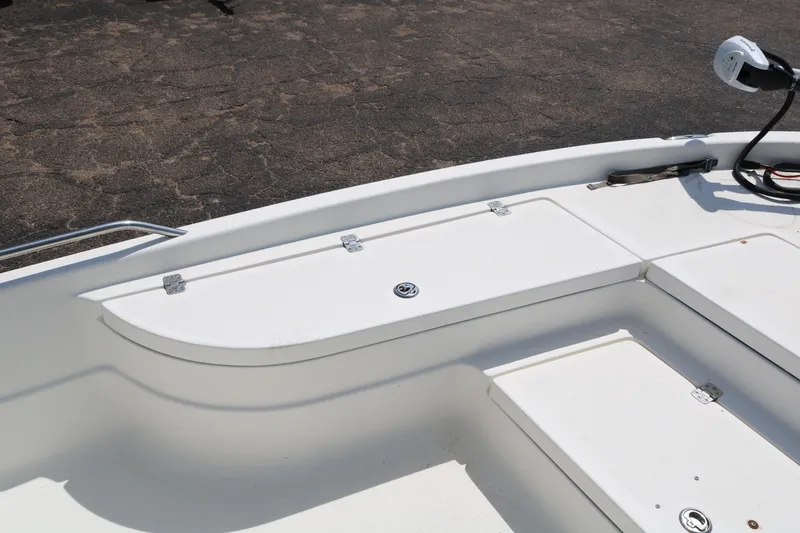 Slide: The Image of 2005 NauticStar 2200 Nautic Bay boat deck with storage compartments. - 11