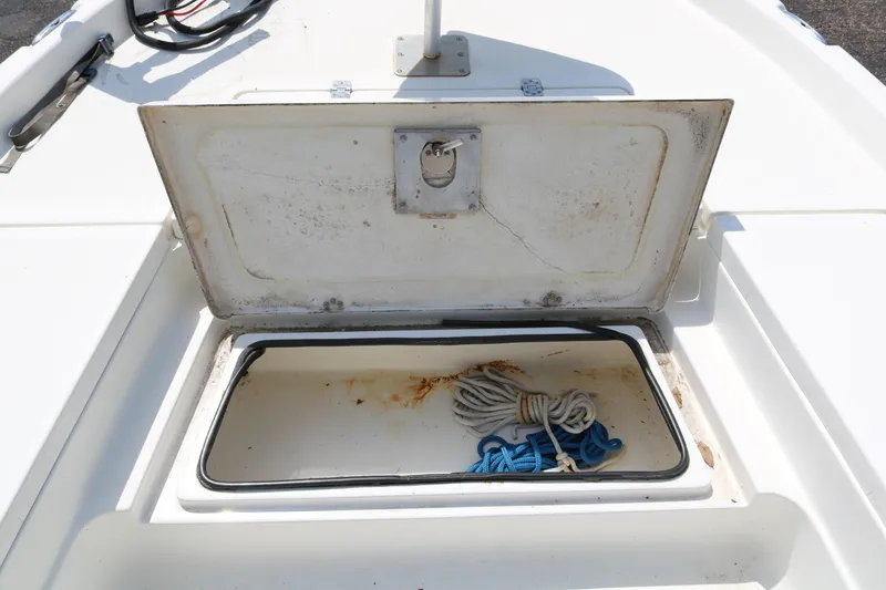 Slide: The Image of Open storage compartment on 2005 NauticStar 2200 Nautic Bay boat with ropes inside. - 14