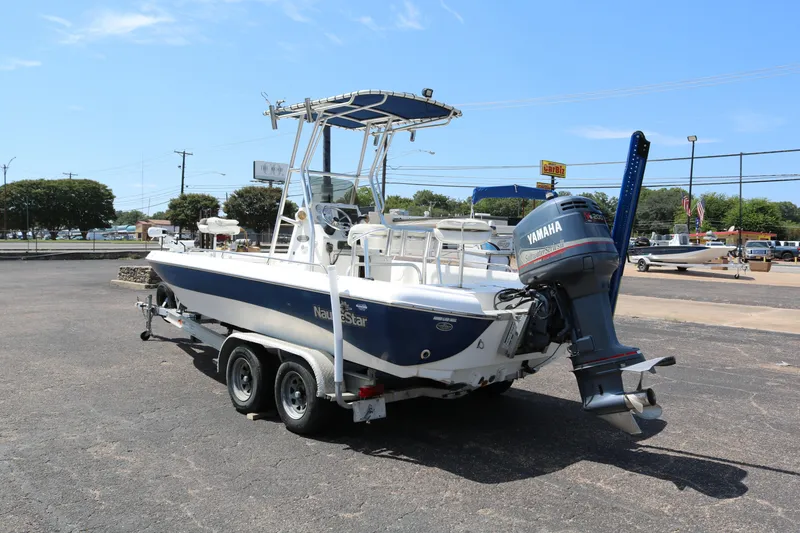 Slide: The Image of 2005 NauticStar 2200 Nautic Bay boat with Yamaha outboard motor on trailer. - 3