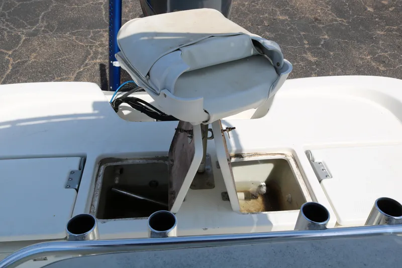 Slide: The Image of 2005 NauticStar 2200 Nautic Bay boat with open storage compartments and seating. - 30