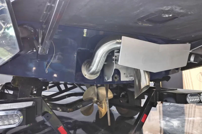 Slide: The Image of 2019 Axis A20 boat underside showing propeller and exhaust system. - 15