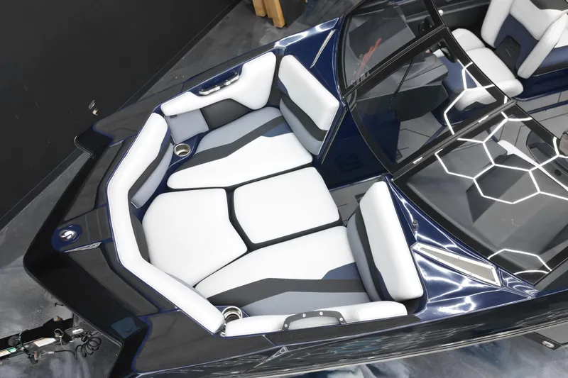 Slide: The Image of 2019 Axis A20 boat interior with white and gray seating, modern design. - 7