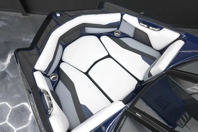 Slide: The Image of 2019 Axis A20 boat interior with sleek, modern seating and cup holders. - 8