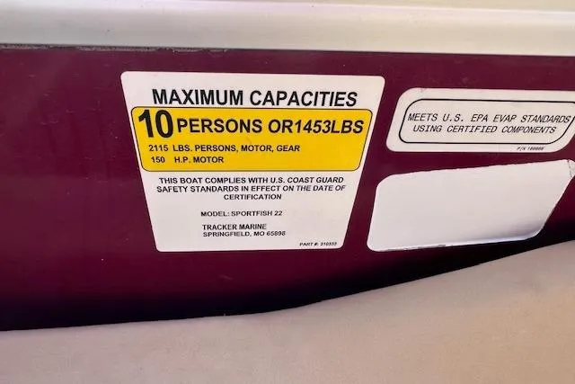 Slide: The Image of 2018 Sun Tracker SportFish 22 DLX capacity label: 10 persons or 1453 lbs, 150 HP motor. - 19